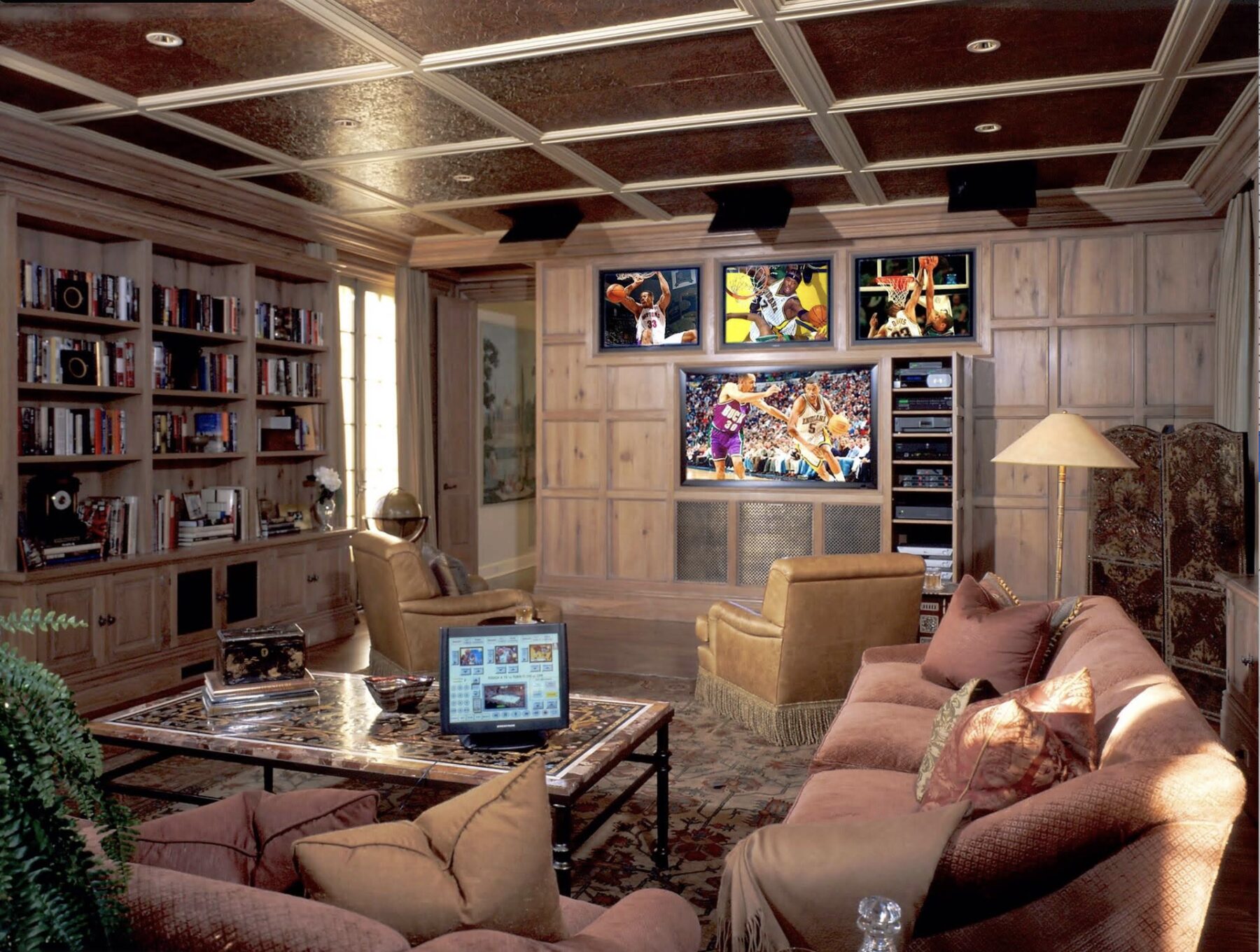 A discreet TV lift installation by HiFi Club, hidden into a bedroom furniture piece