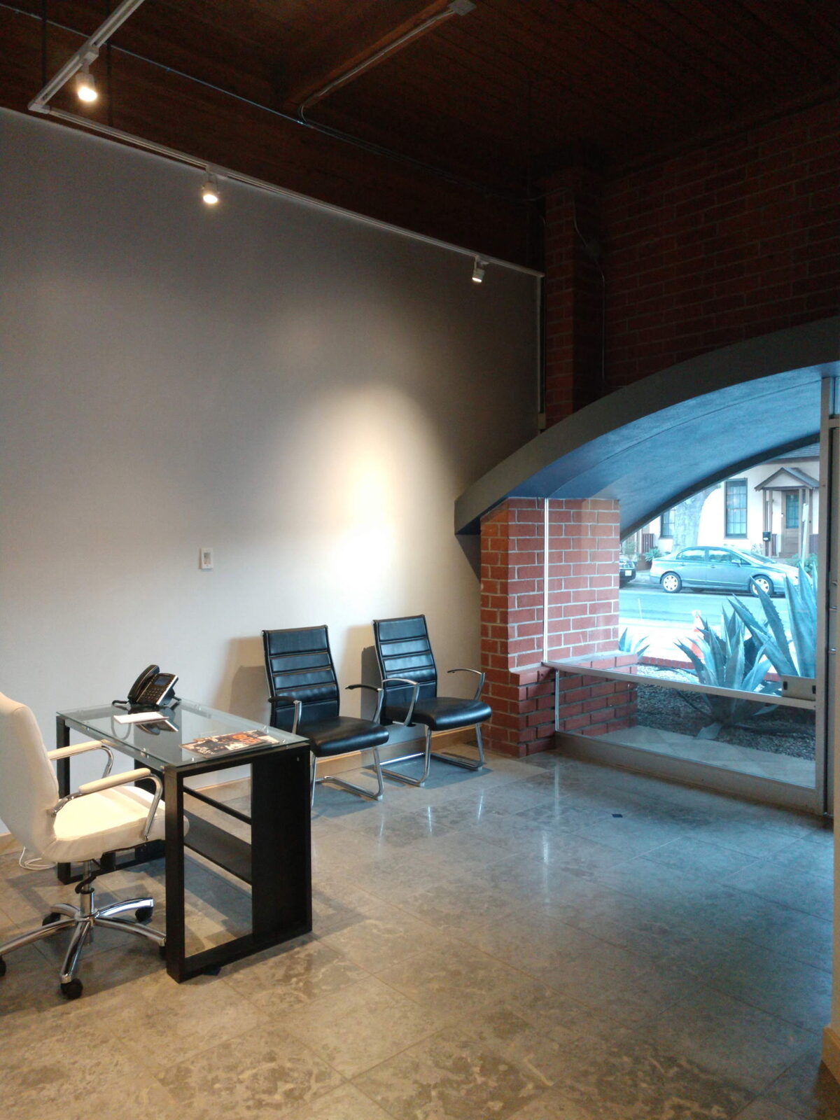 Wilco Group's built-out office entrance at 532 Santa Barbara Street, showing the arched brick entryway